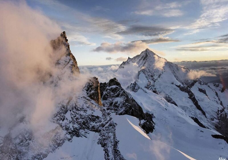 Snowy mountain peaks at sunrise