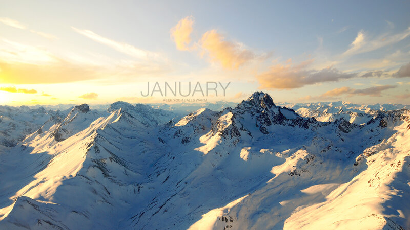 Snowy mountain peaks at sunrise
