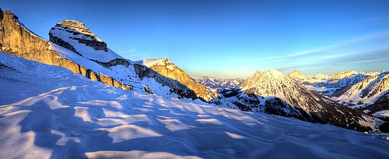 Snowy mountain peaks at sunrise