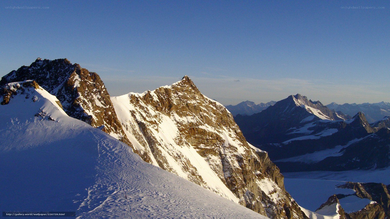 Snowy mountain peaks at sunrise