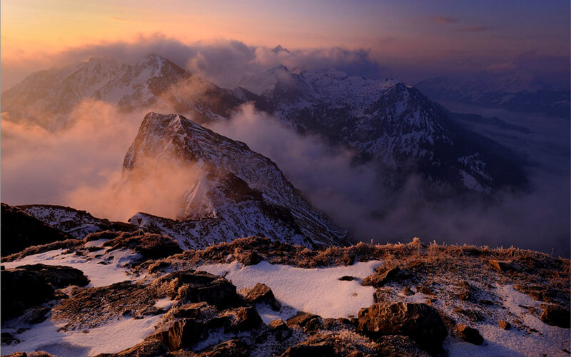 Snowy mountain peaks at sunrise