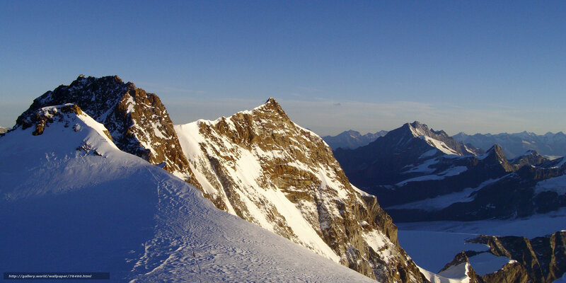 snowy mountain peaks at sunrise