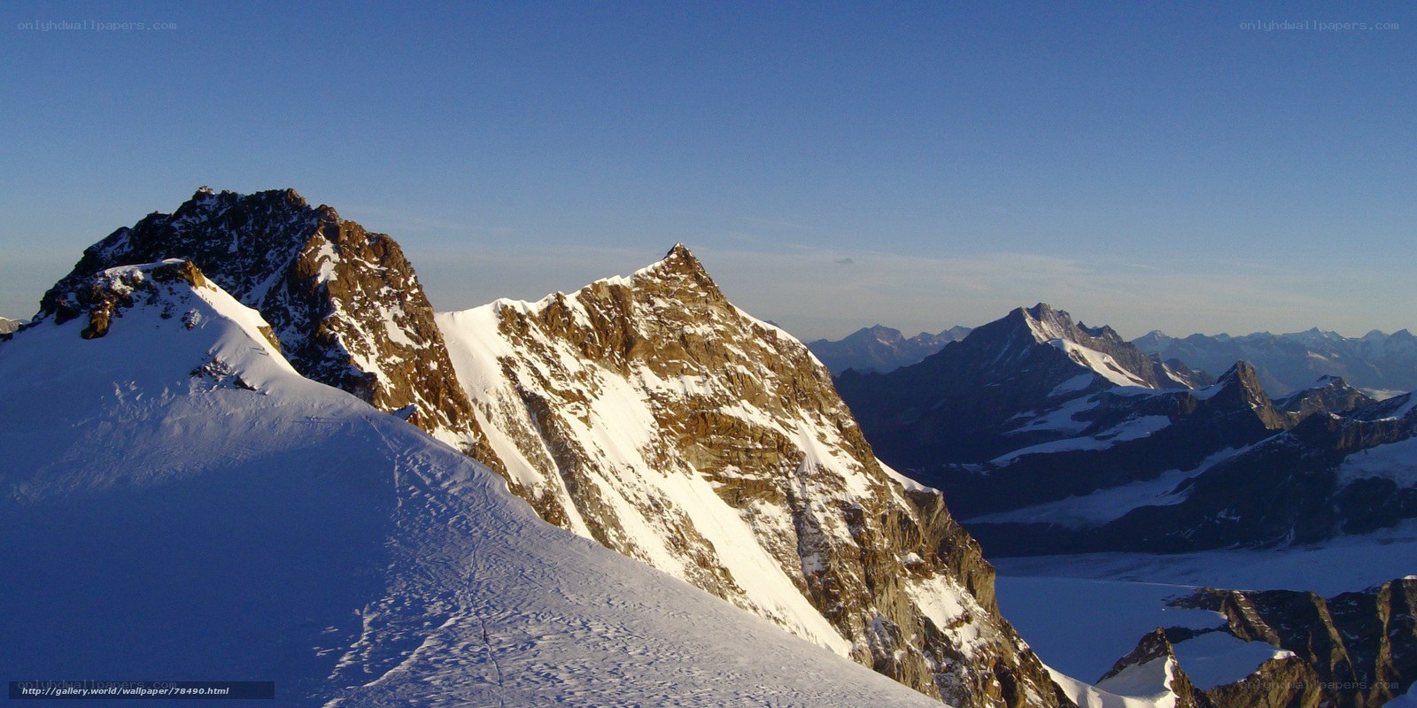 snowy mountain peaks at sunrise