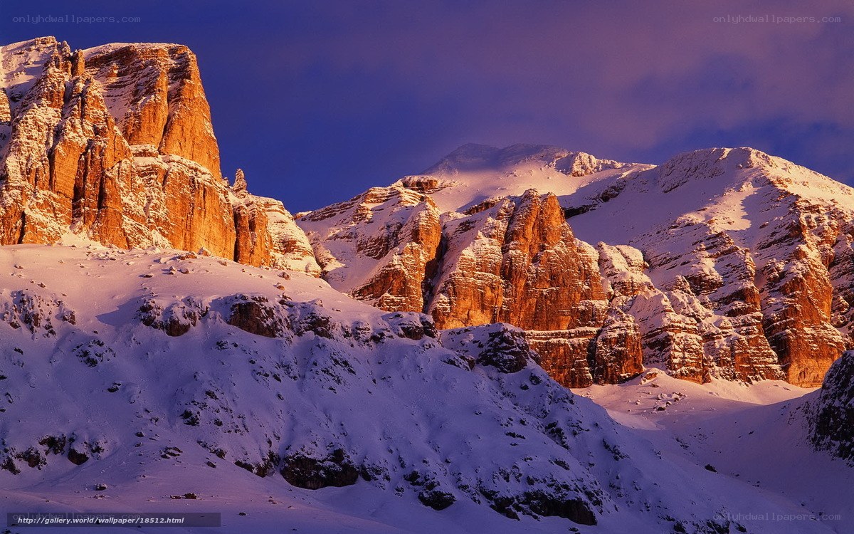 Snowy mountain peaks at sunset