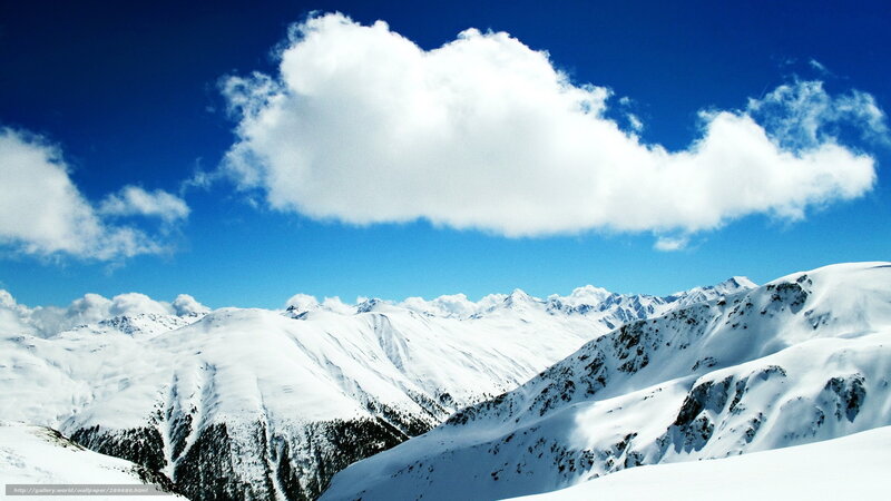 Snowy mountain peaks under blue sky