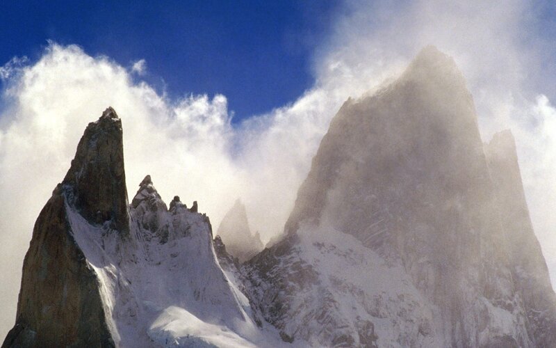Snowy mountain peaks under blue sky