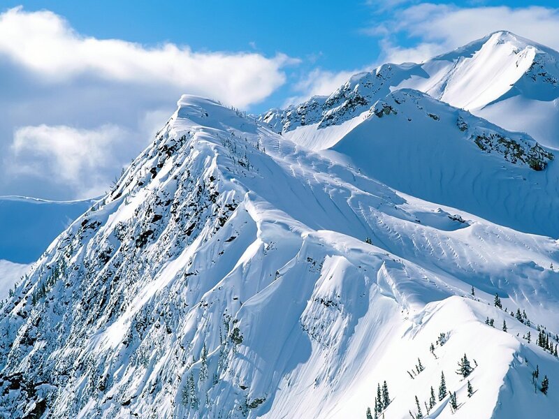 Snowy mountain peaks under blue sky