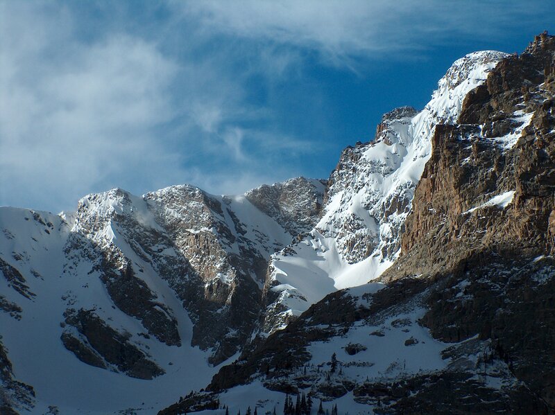 Snowy mountain peaks under blue sky