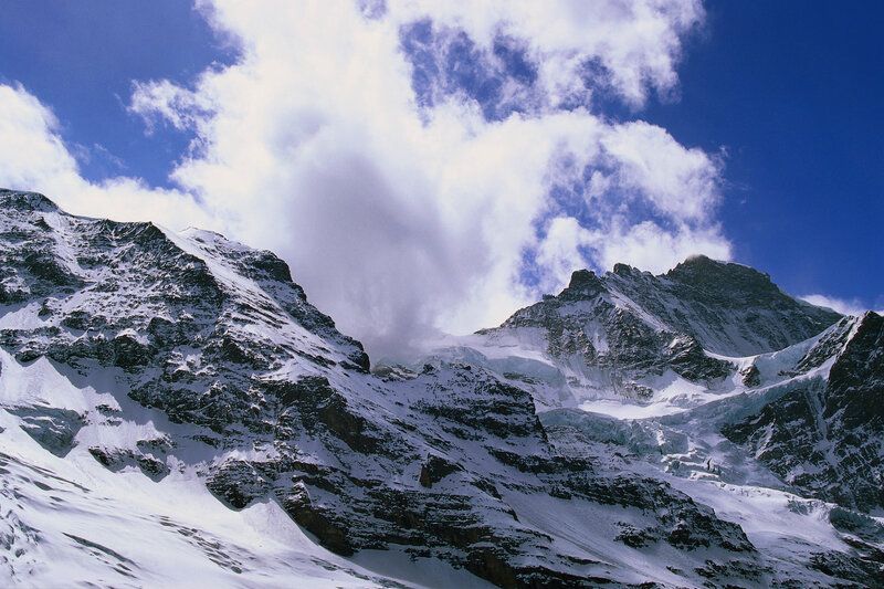 Snowy mountain peaks under blue sky