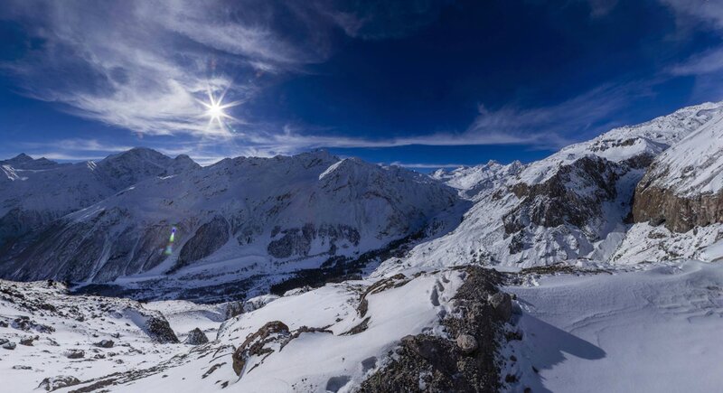 Snowy mountain peaks under blue sky