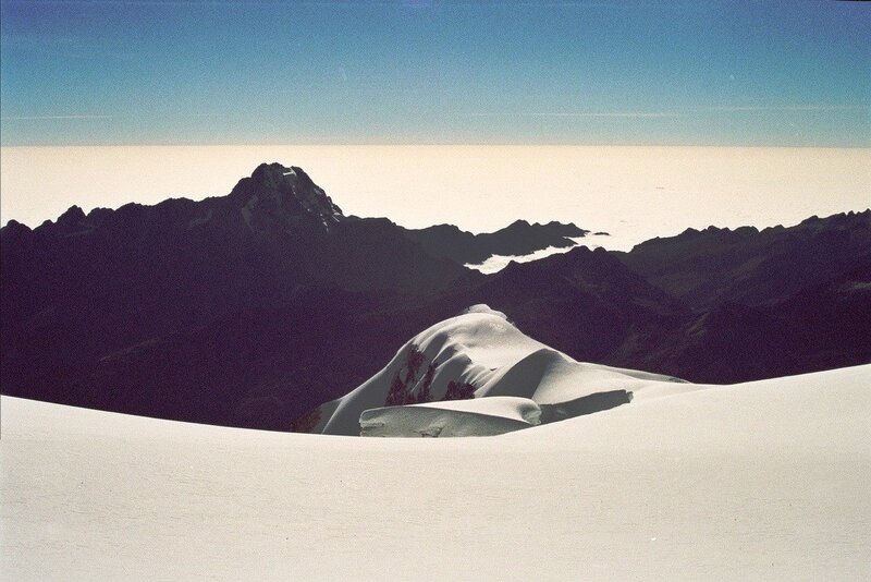 Snowy mountain peaks under blue sky