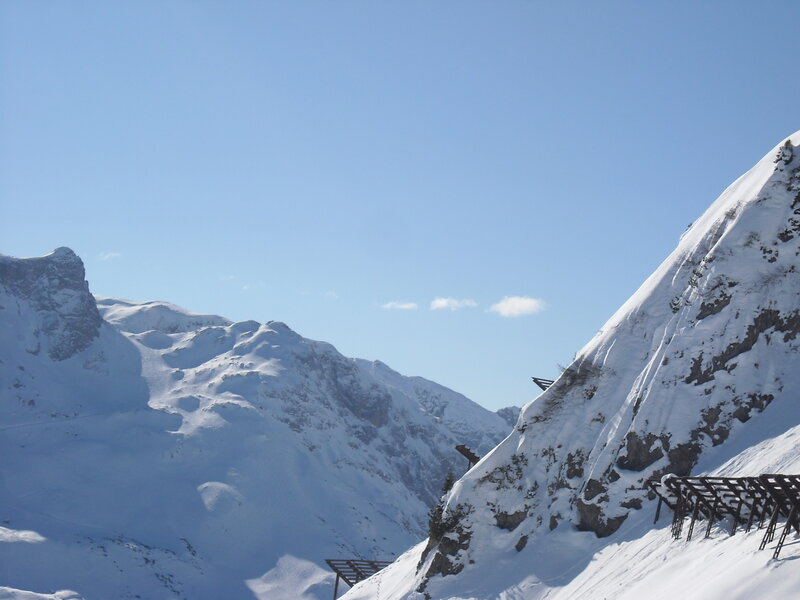 Snowy mountain peaks under blue sky