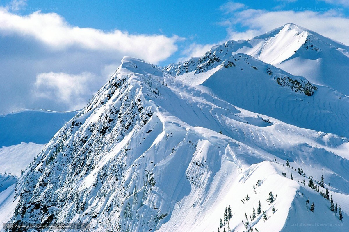 Snowy mountain peaks under blue sky
