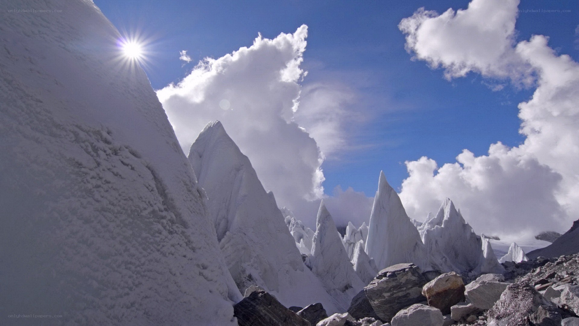 snowy mountain peaks under sun