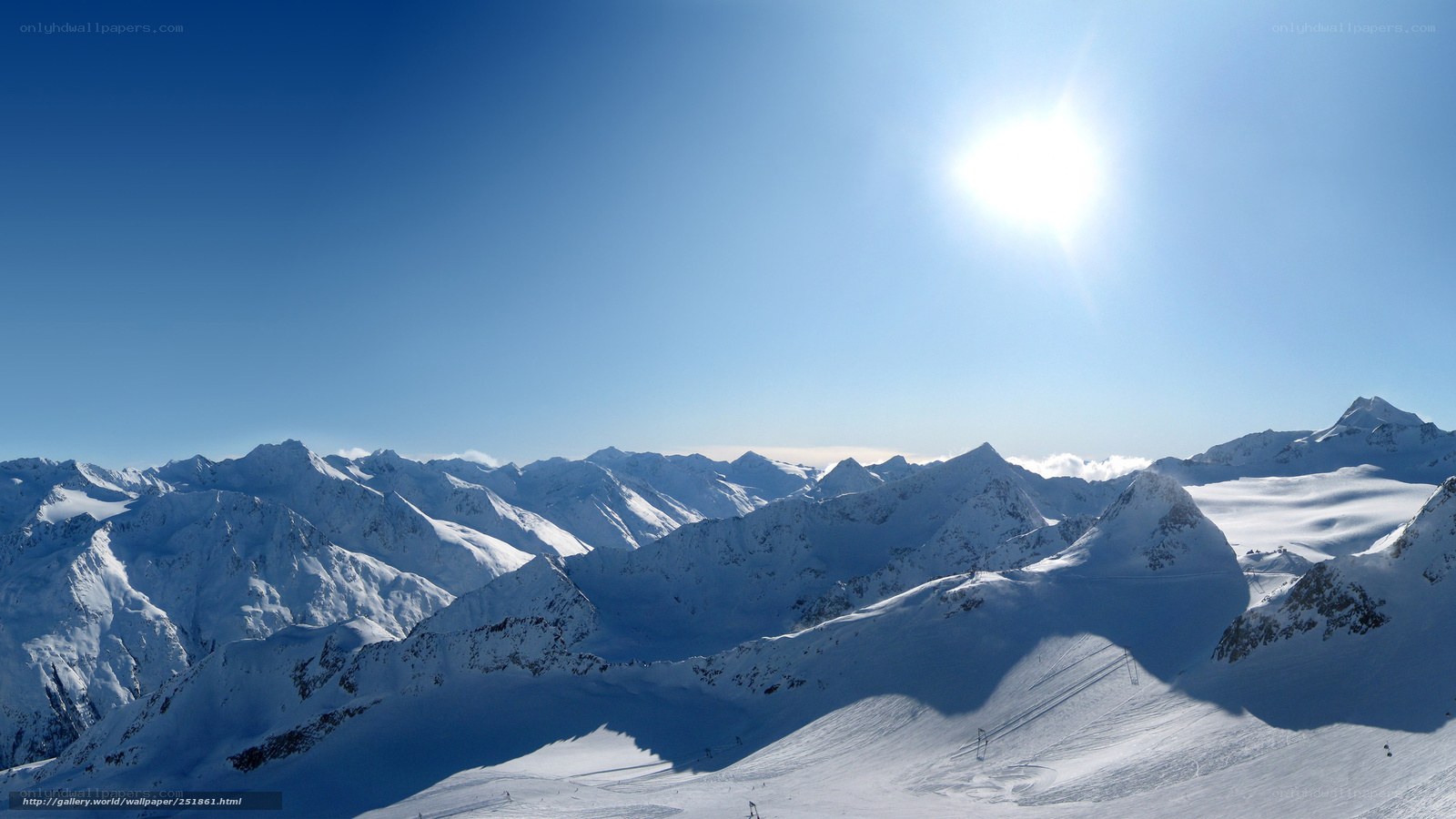 snowy mountain peaks under sun