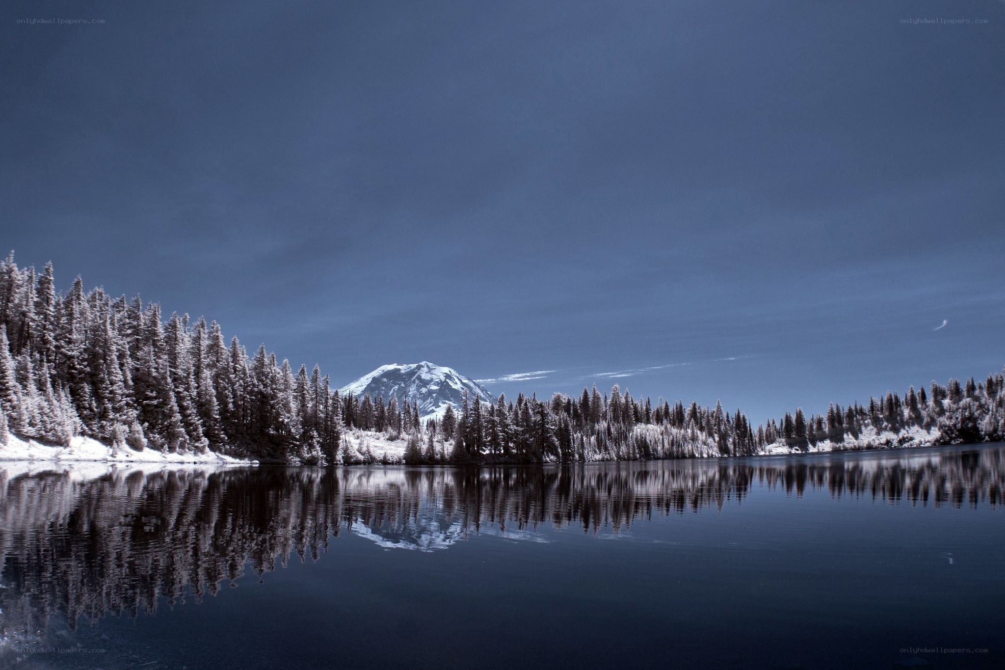 Snowy mountain reflected in a lake