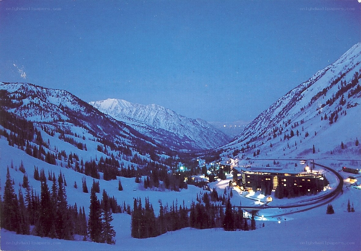 snowy mountain resort at dusk