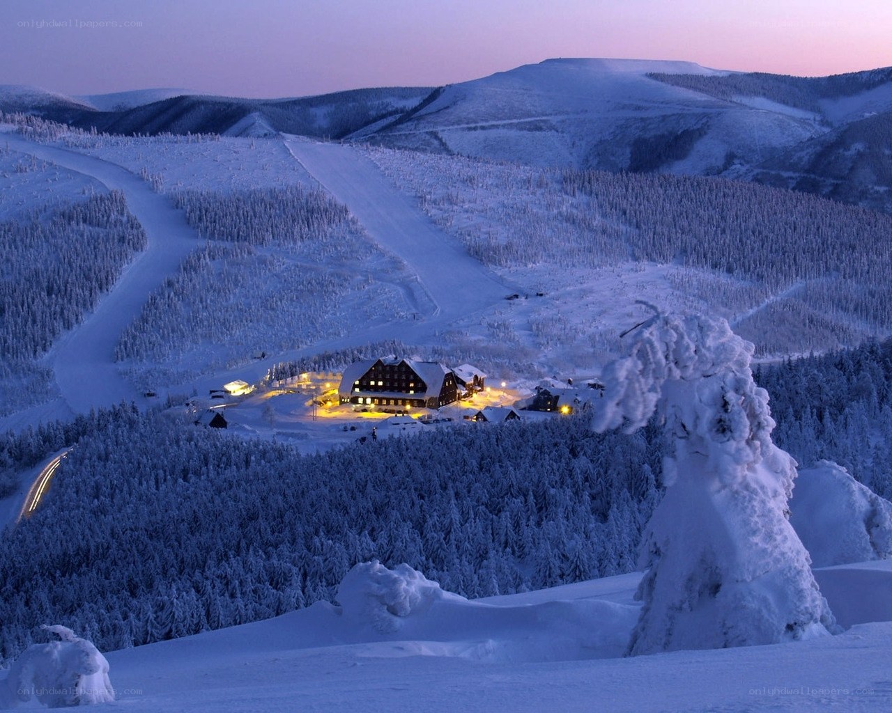 Snowy mountain resort at dusk
