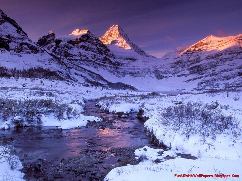 snowy mountain river at sunset