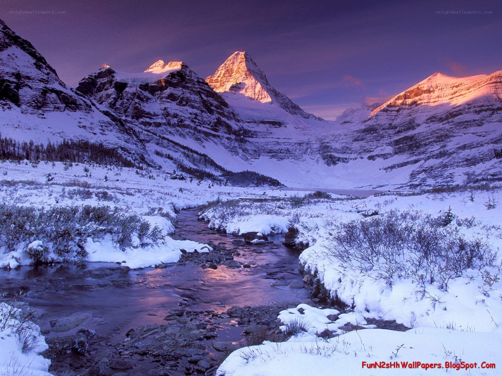 snowy mountain river at sunset