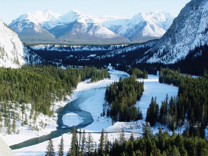 snowy mountain river valley