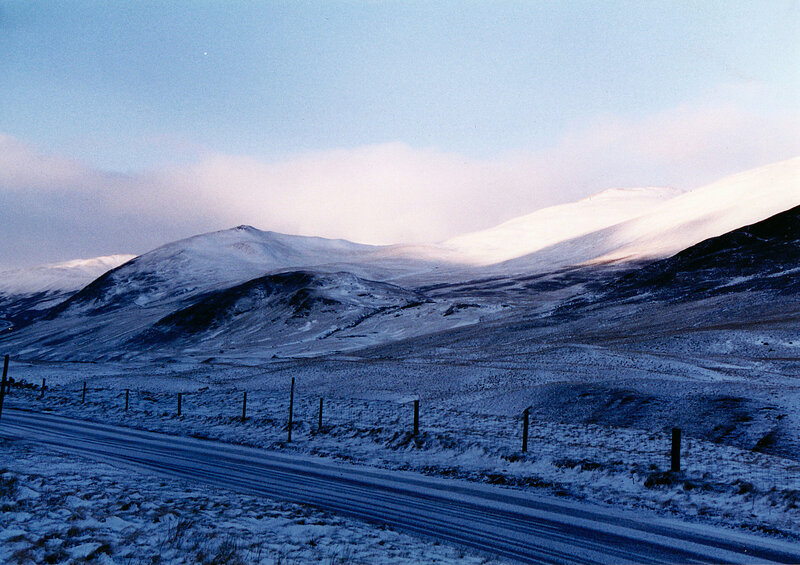Snowy mountain road at dusk