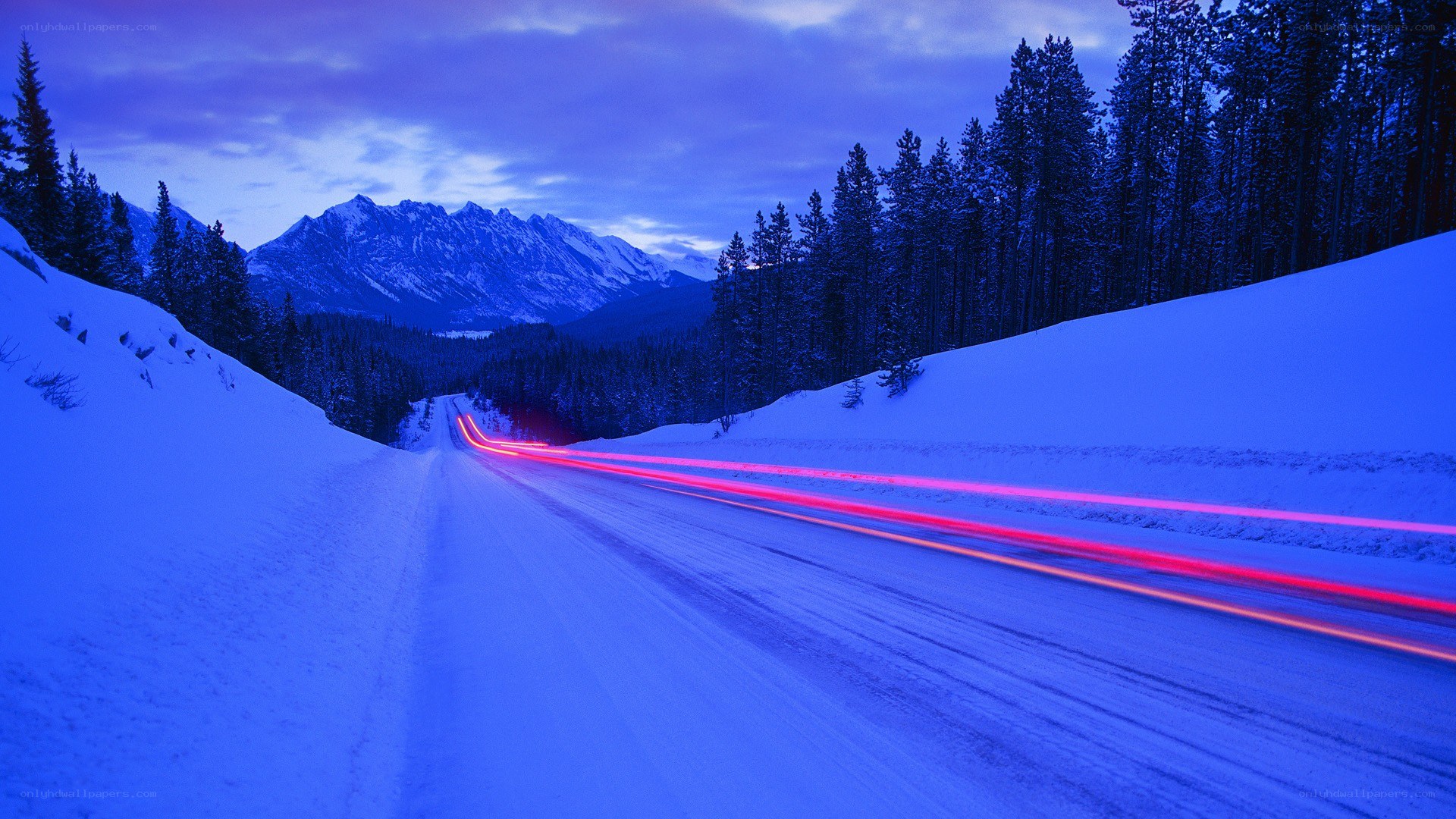 Snowy mountain road at dusk