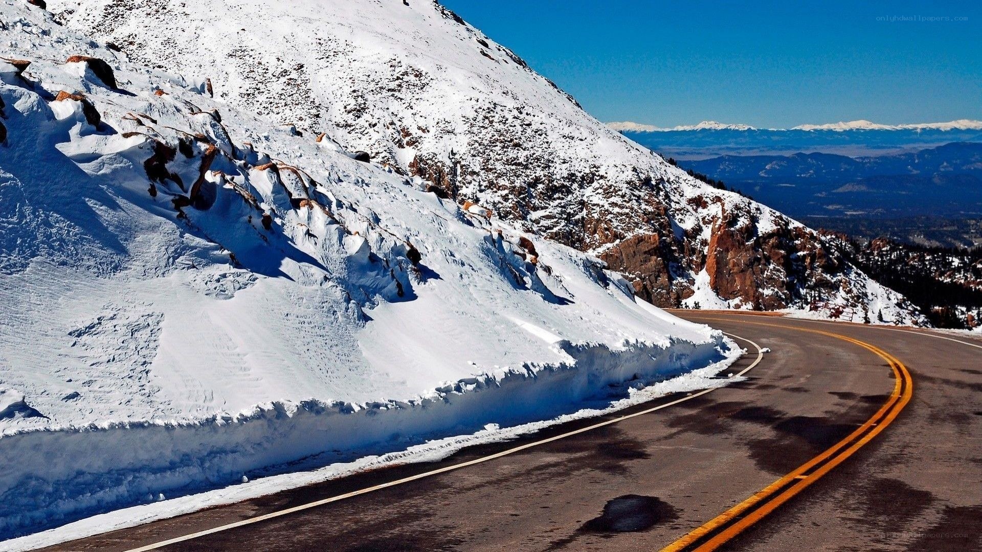 Snowy mountain road curve