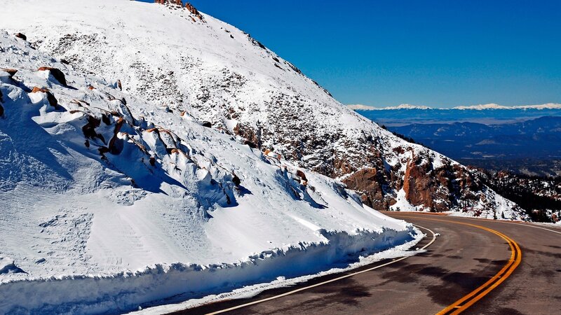 Snowy mountain road curve