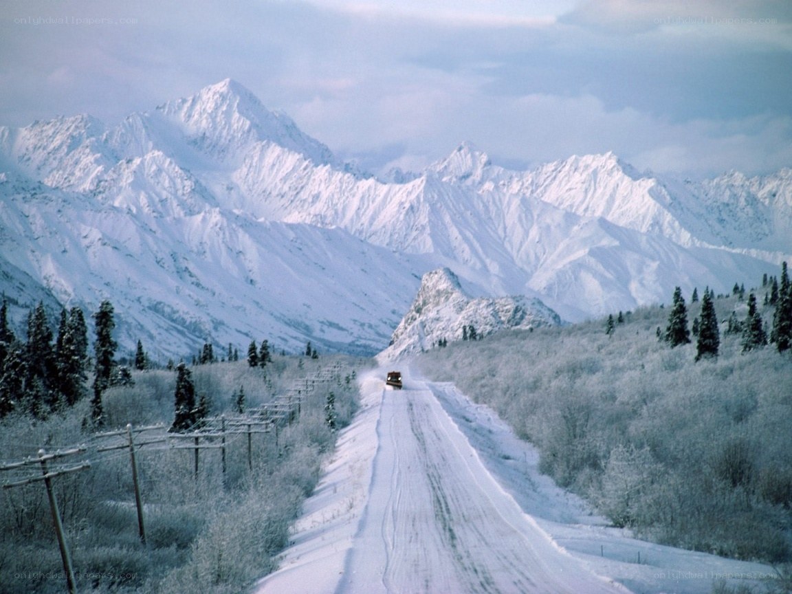 Snowy mountain road with truck