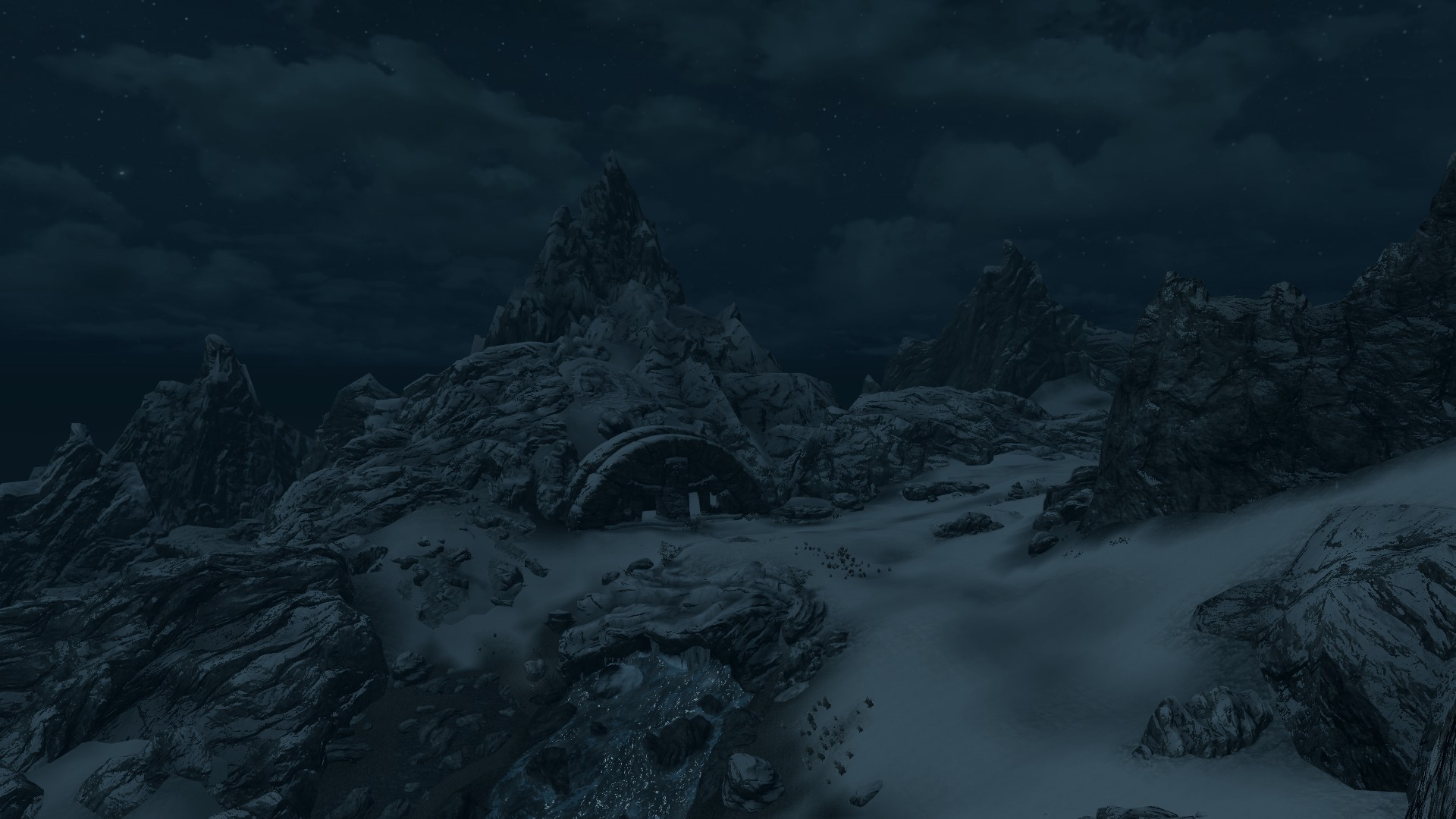 snowy mountain ruins at night