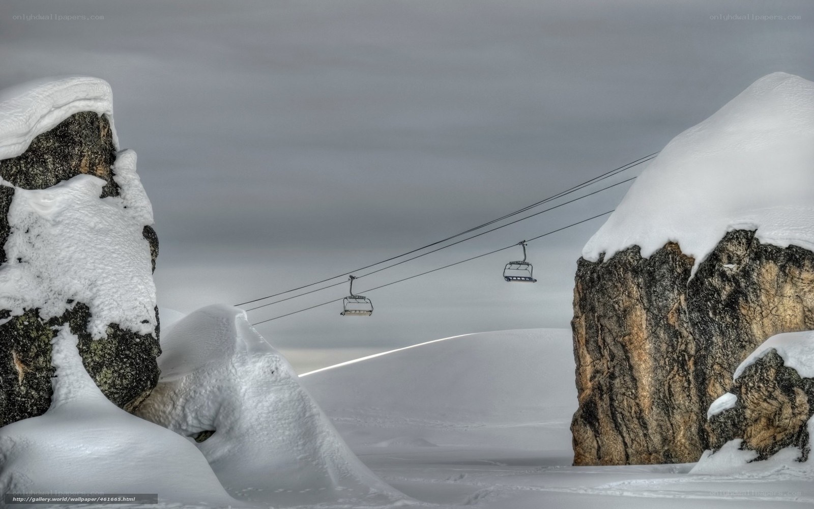 Snowy mountain ski lift