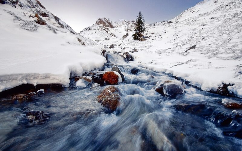 Snowy mountain stream