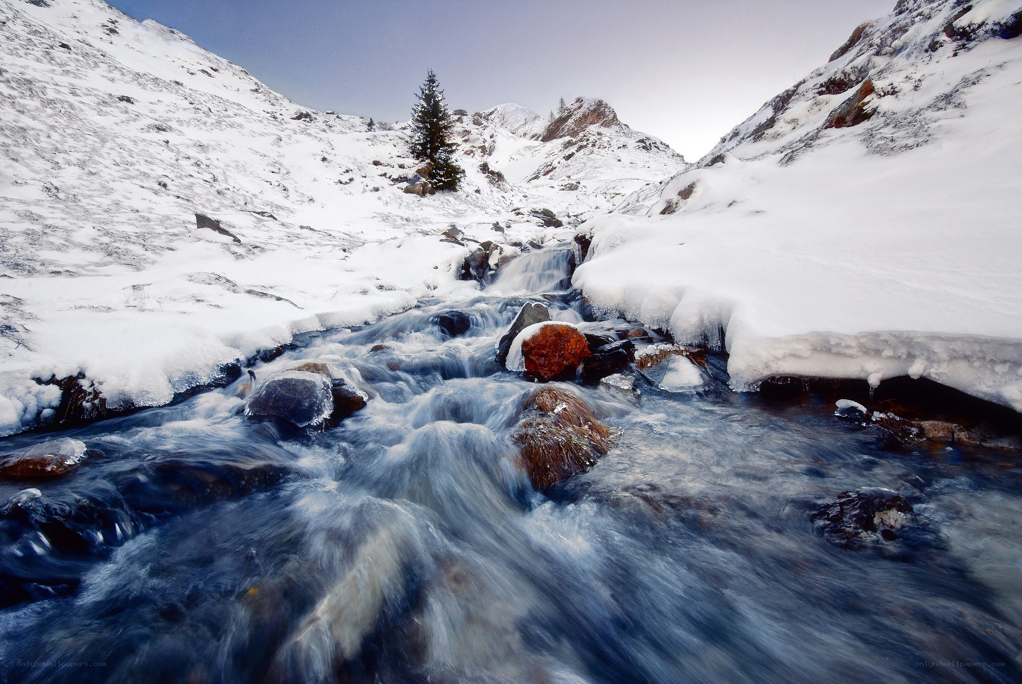 Snowy mountain stream