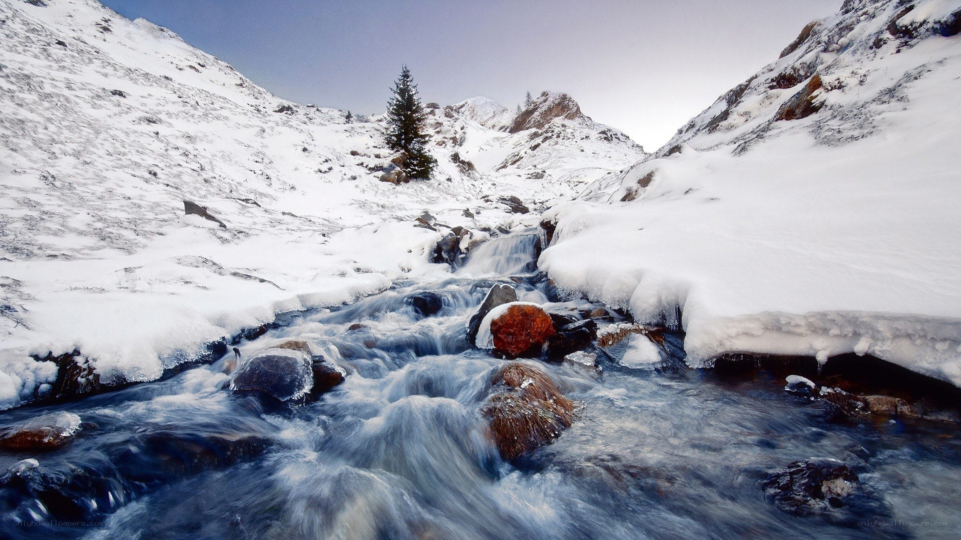snowy mountain stream