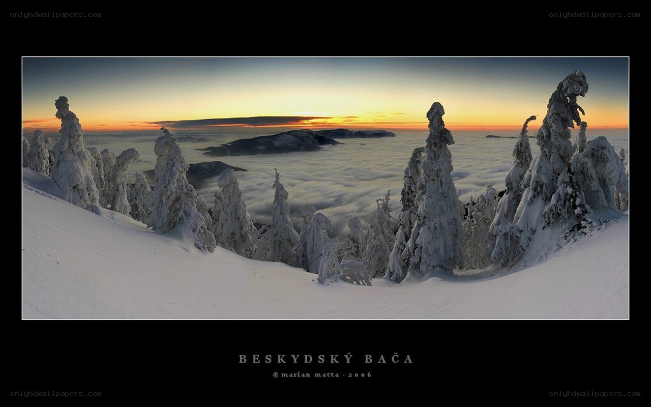 Snowy mountain sunrise panorama