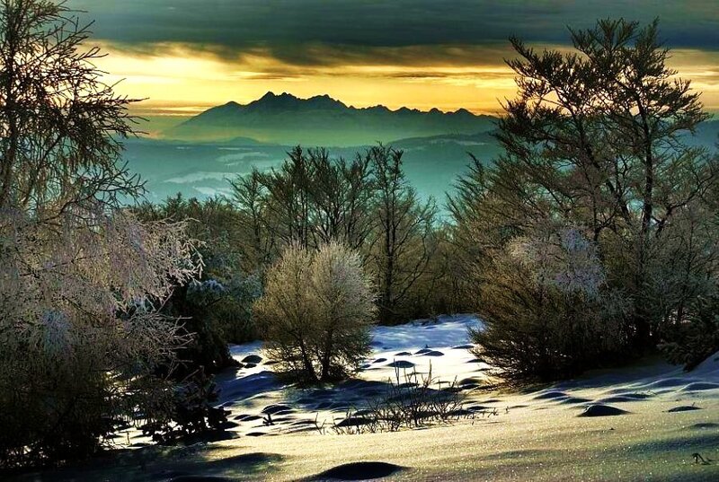 Snowy mountain sunset landscape