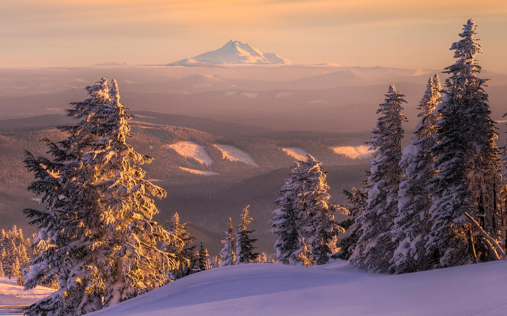 Snowy mountain sunset landscape