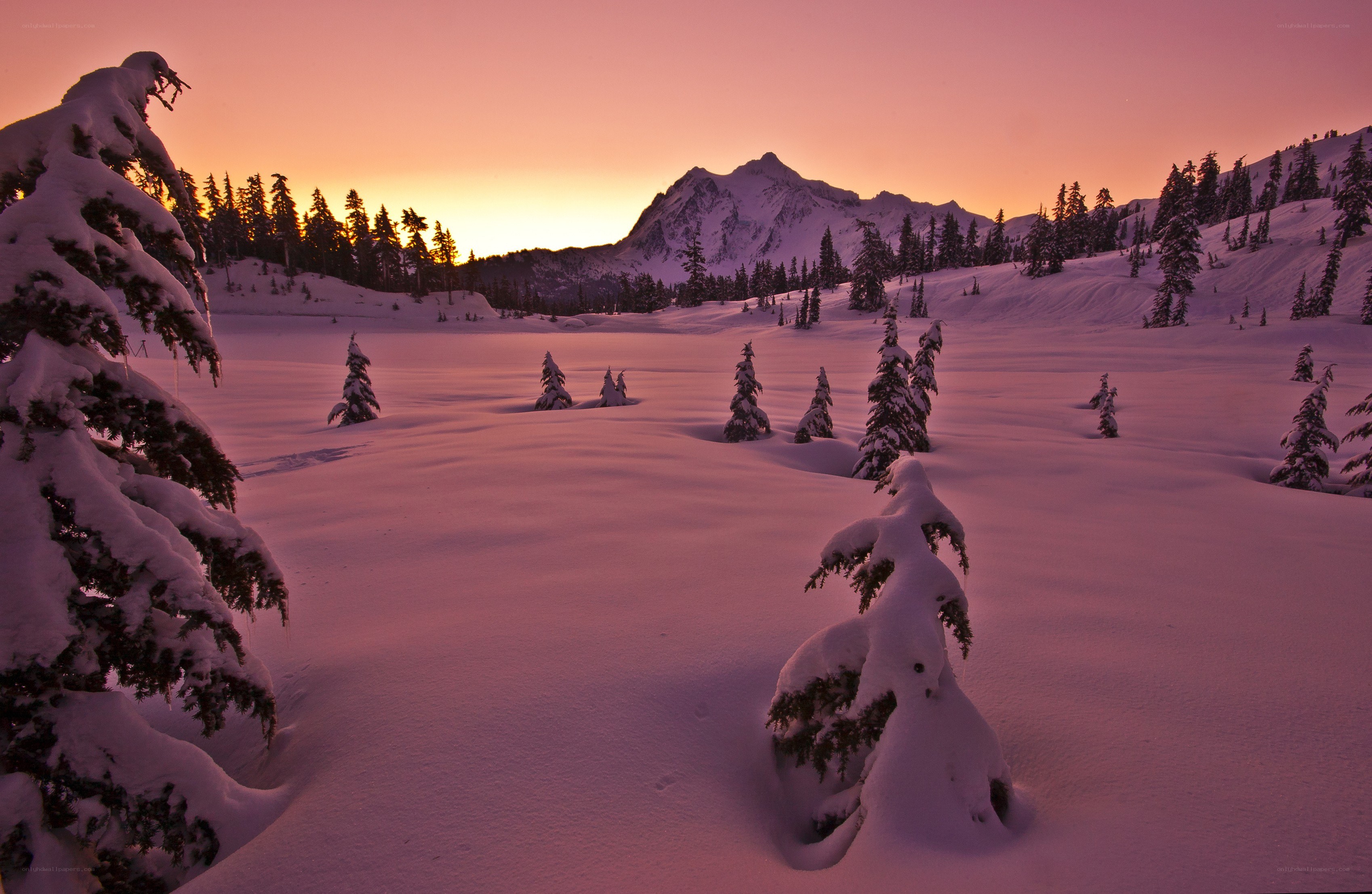 Snowy mountain sunset landscape