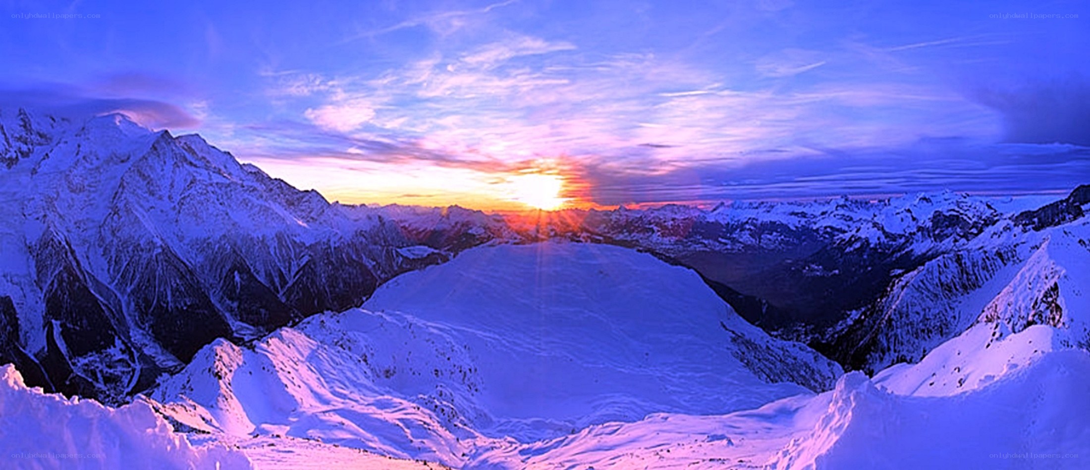 Snowy mountain sunset panorama