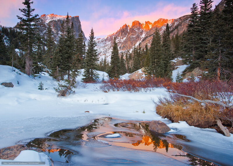 Snowy mountain sunset reflection