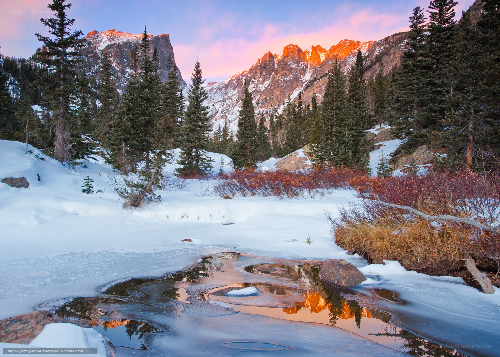Snowy mountain sunset reflection