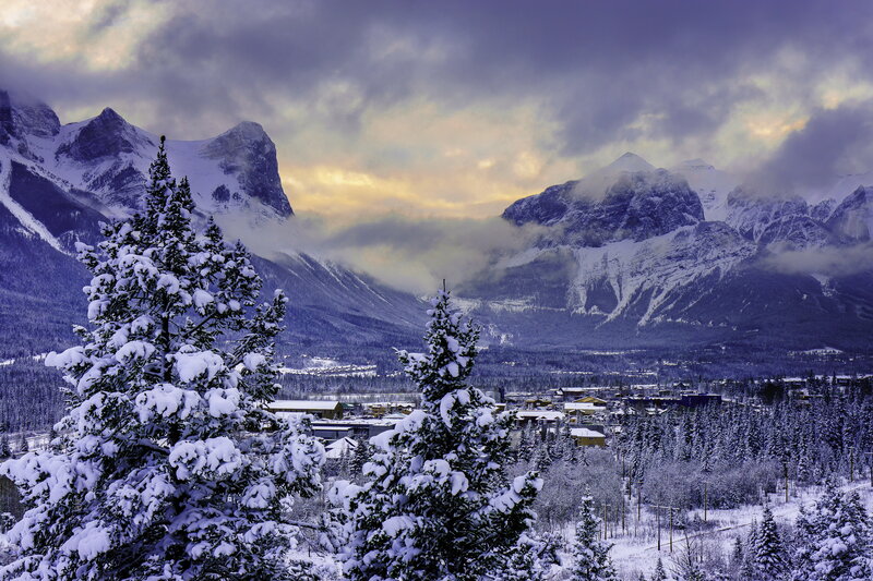 Snowy mountain town at dusk