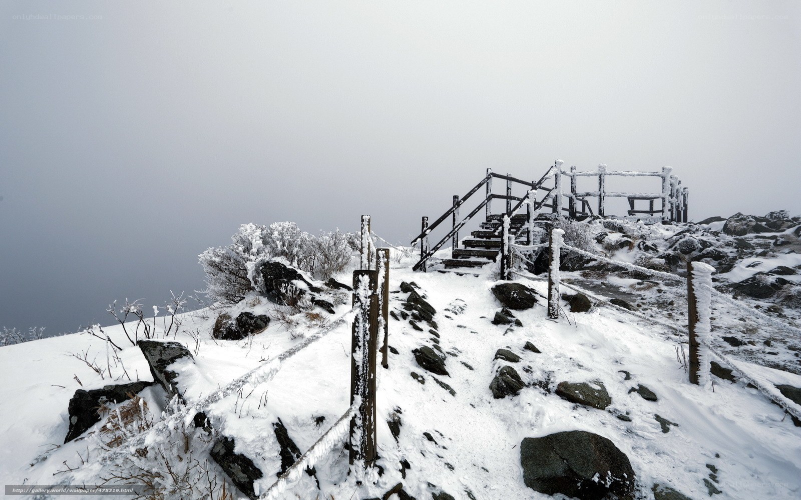 Snowy mountain trail with stairs