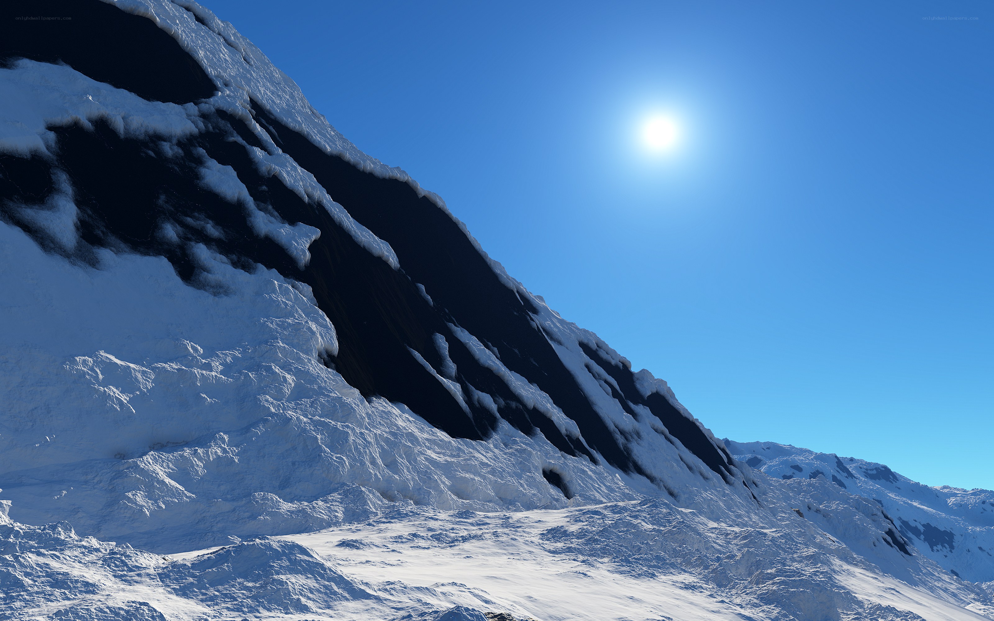 Snowy mountain under bright sun
