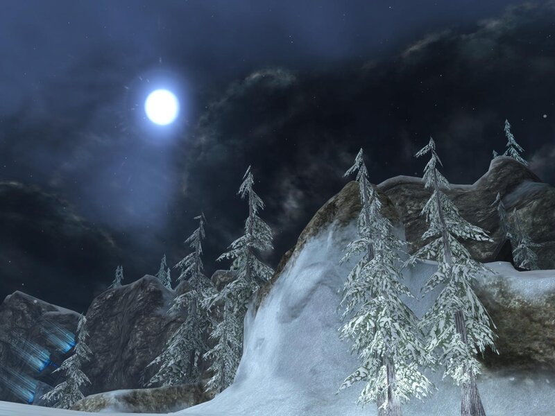snowy mountain under moonlight