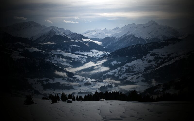 Snowy mountain valley at dawn