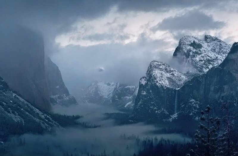 Snowy mountain valley at dawn