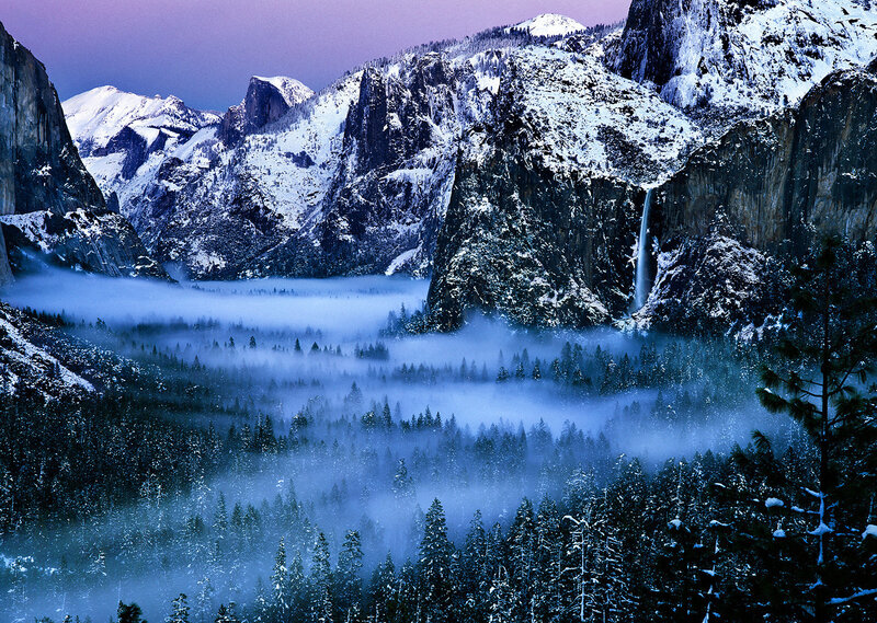 Snowy mountain valley at dawn
