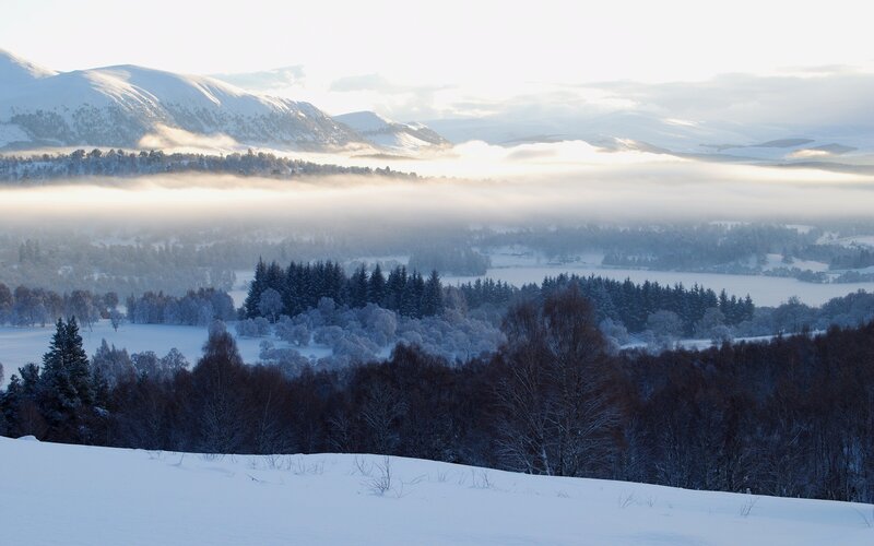 Snowy mountain valley at dawn